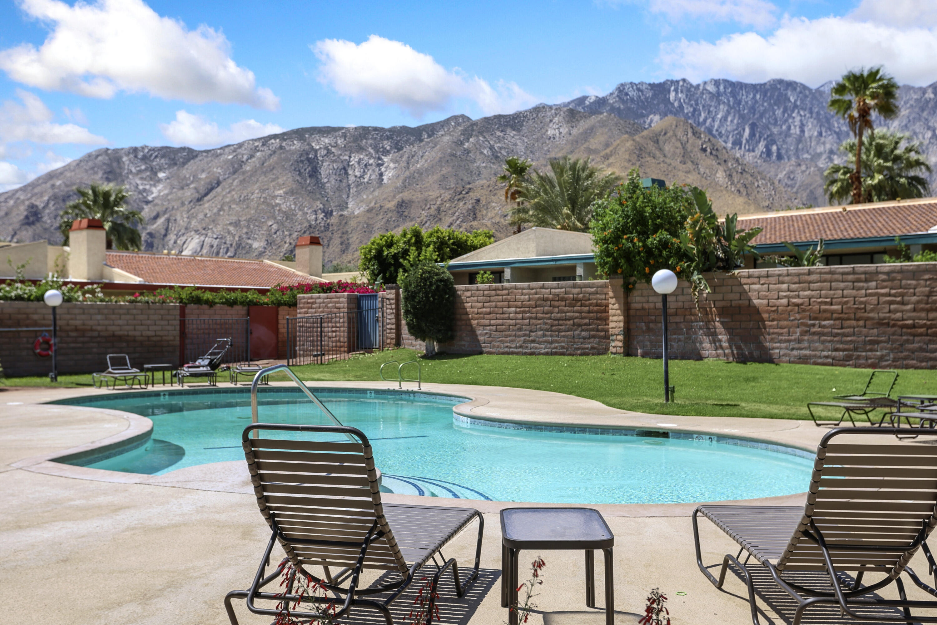 377 West Dominguez Road Palm Springs, CA 92262 - Photo 28 of 29 a view of a chairs and table in backyard