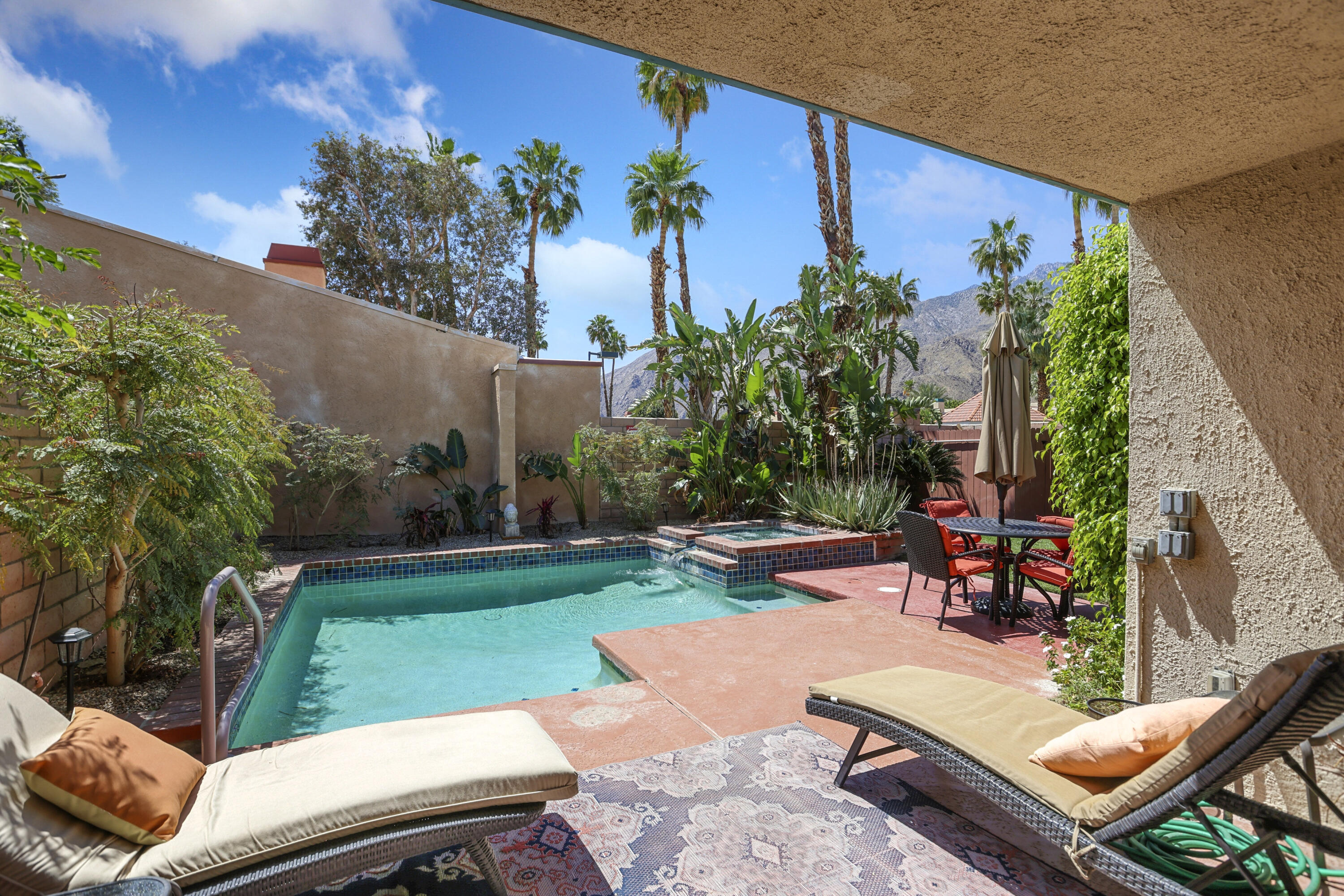 377 West Dominguez Road Palm Springs, CA 92262 - Photo 3 of 29 swimming view of a backyard with sitting area