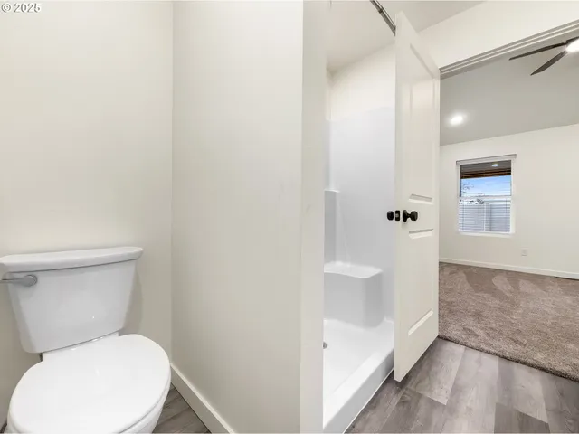 a white toilet sitting next to a bathroom sink