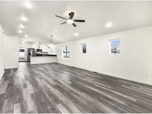 a view of a kitchen with a dishwasher and cabinets