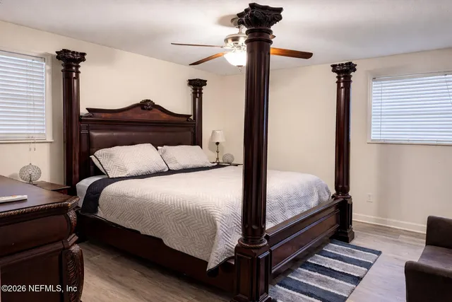 a bedroom with a bed and a dresser