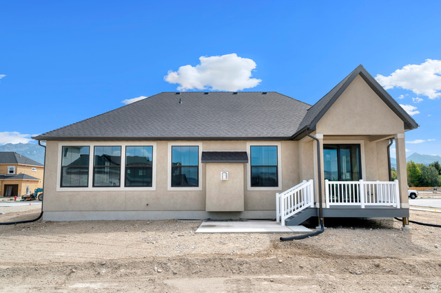 11718 South Halls Crk Road Draper, UT 84020 - Photo 5 of 28 View of front of home with stucco siding, roof with shingles, a patio area, and a mountain view