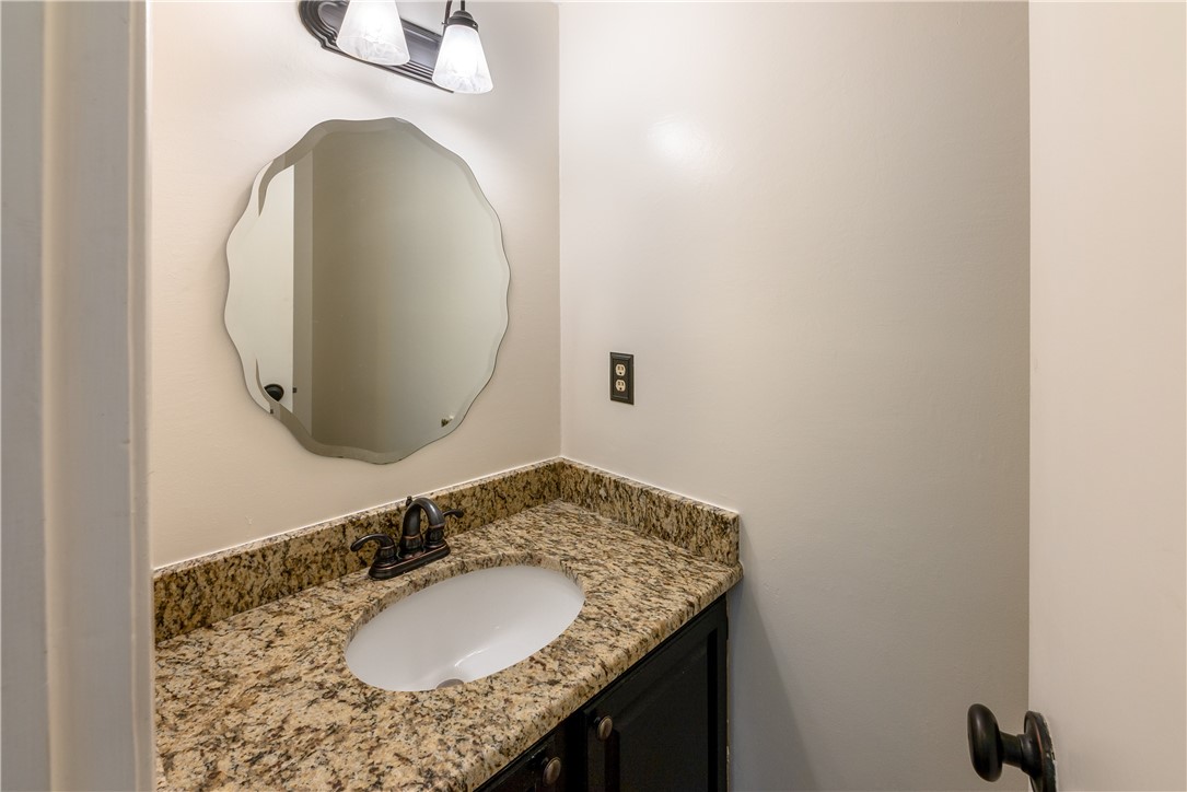 12702 Rhea Court Austin, TX 78727 - Photo 6 of 19 Guest bath down with granite and designer mirror