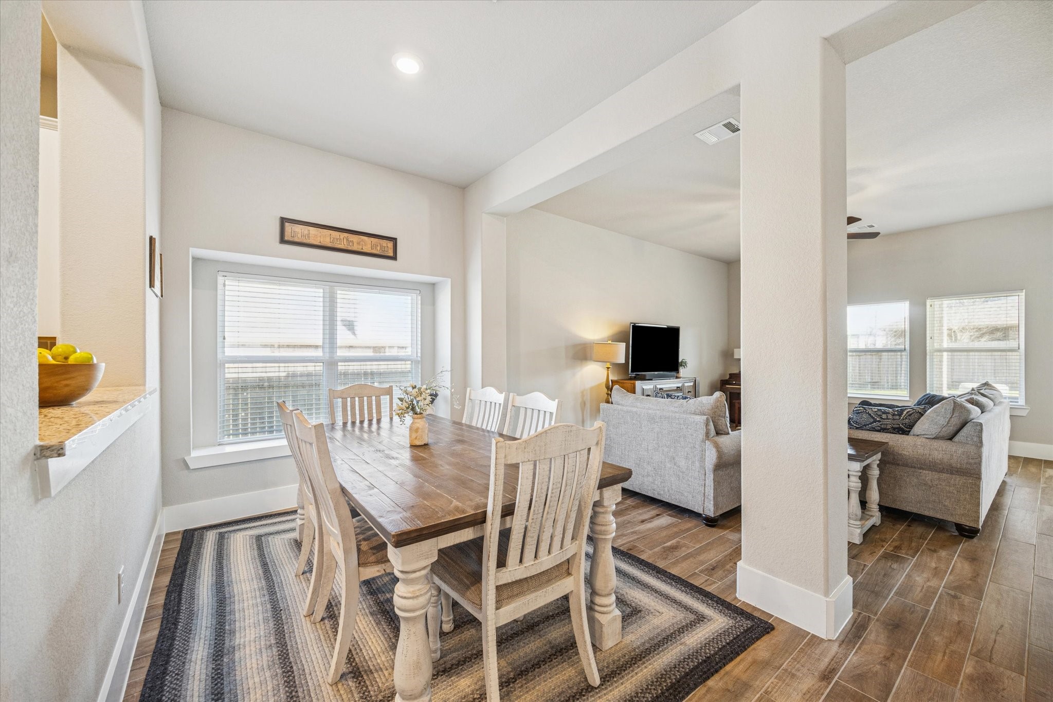 24030 Willow Rose Drive Spring, TX 77389 - Photo 12 of 39 Large window provides abundant natural light. Dining area opens to downstairs living area.