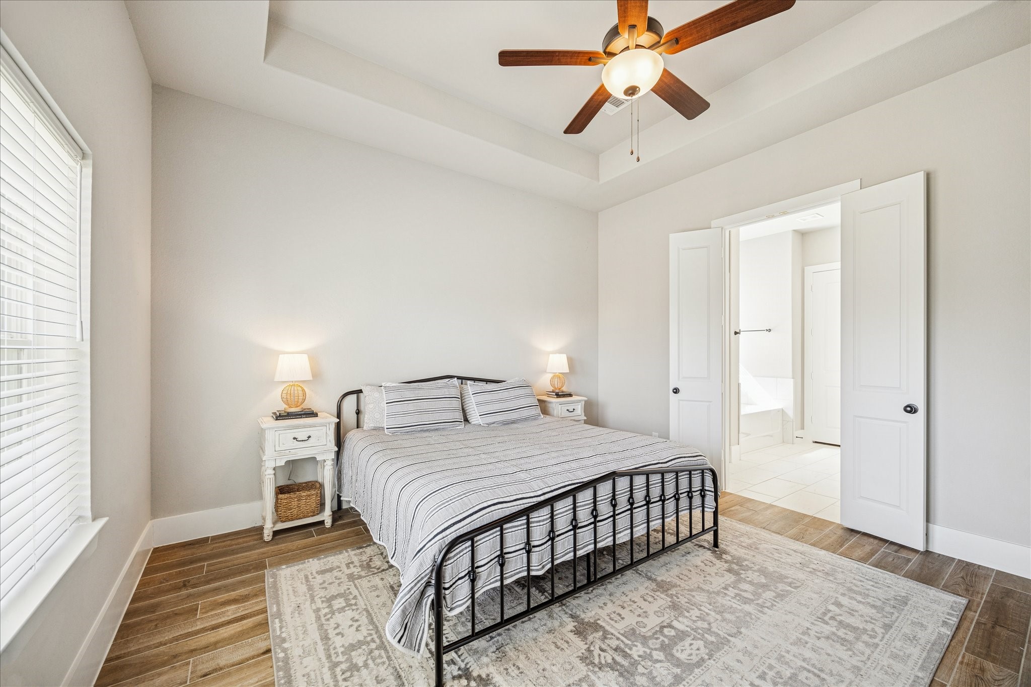 24030 Willow Rose Drive Spring, TX 77389 - Photo 15 of 39 Spacious primary bedroom with high ceilings, abundant natural light, & ensuite bathroom.
