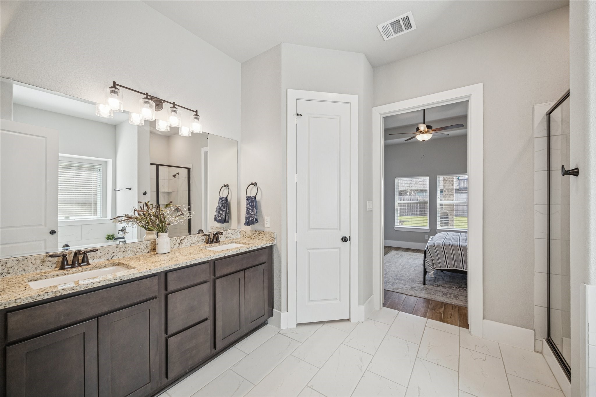 24030 Willow Rose Drive Spring, TX 77389 - Photo 17 of 39 Double vanity with granite countertops, modern fixtures, & ample cabinetry.