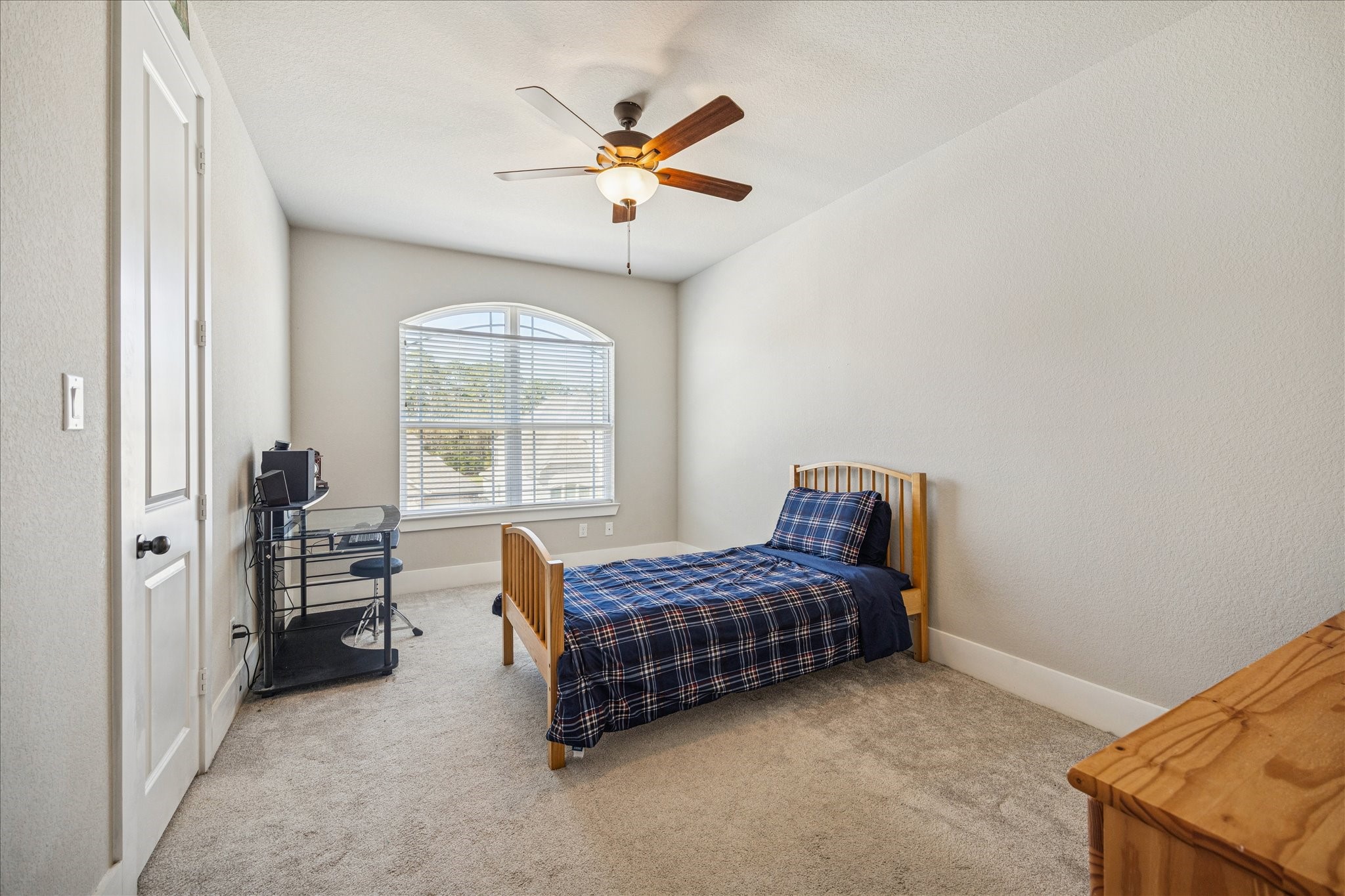 24030 Willow Rose Drive Spring, TX 77389 - Photo 26 of 39 Upstairs bedroom number two has a large window that allows abundant natural light to fill the space.