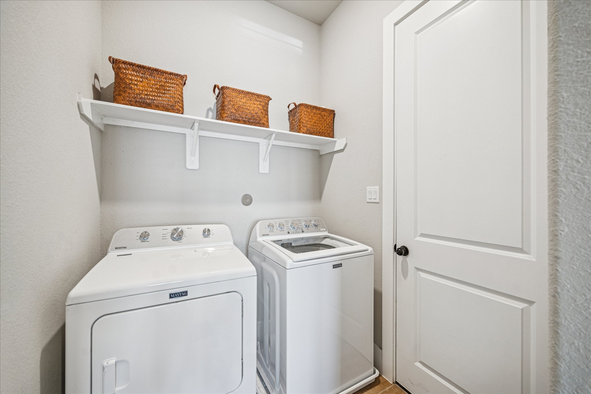 24030 Willow Rose Drive Spring, TX 77389 - Photo 32 of 39 Laundry room with a shelving & a place to hang laundry-- adjoins garage.