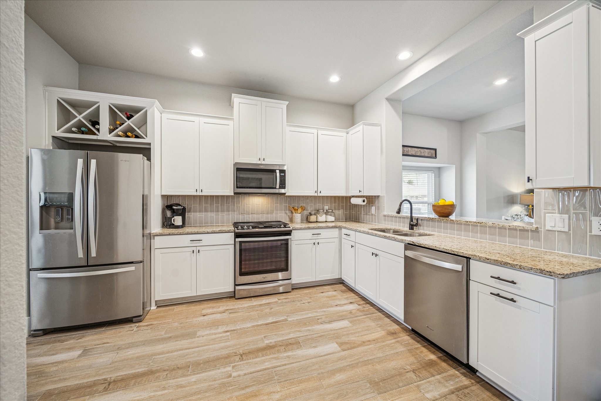 24030 Willow Rose Drive Spring, TX 77389 - Photo 8 of 39 Built-in wine rack over the refrigerator.