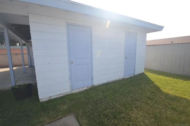 a view of backyard and hardwood