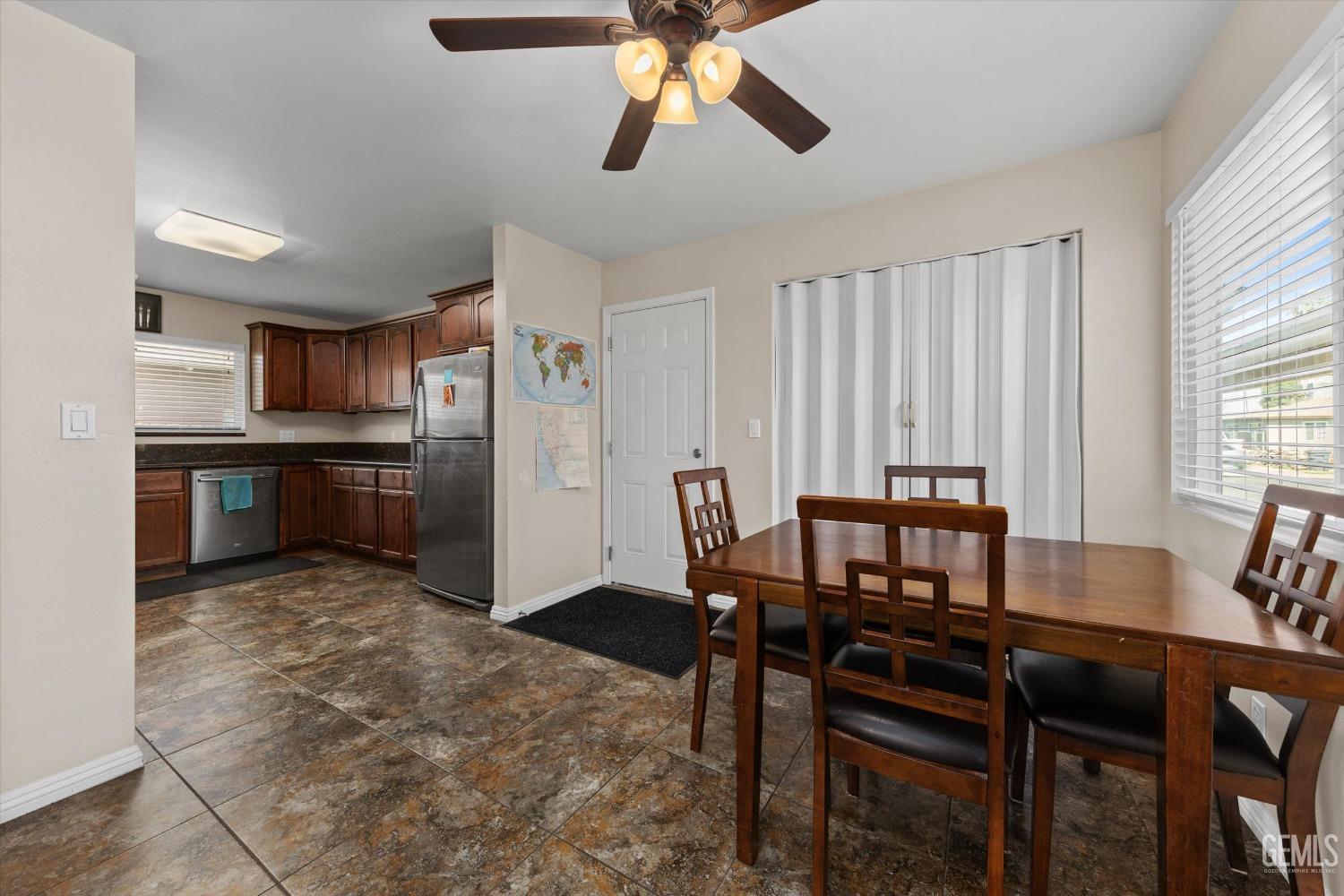 Undisclosed Address Bakersfield, CA 93309 - Photo 12 of 31 a view of a dining room with furniture and window