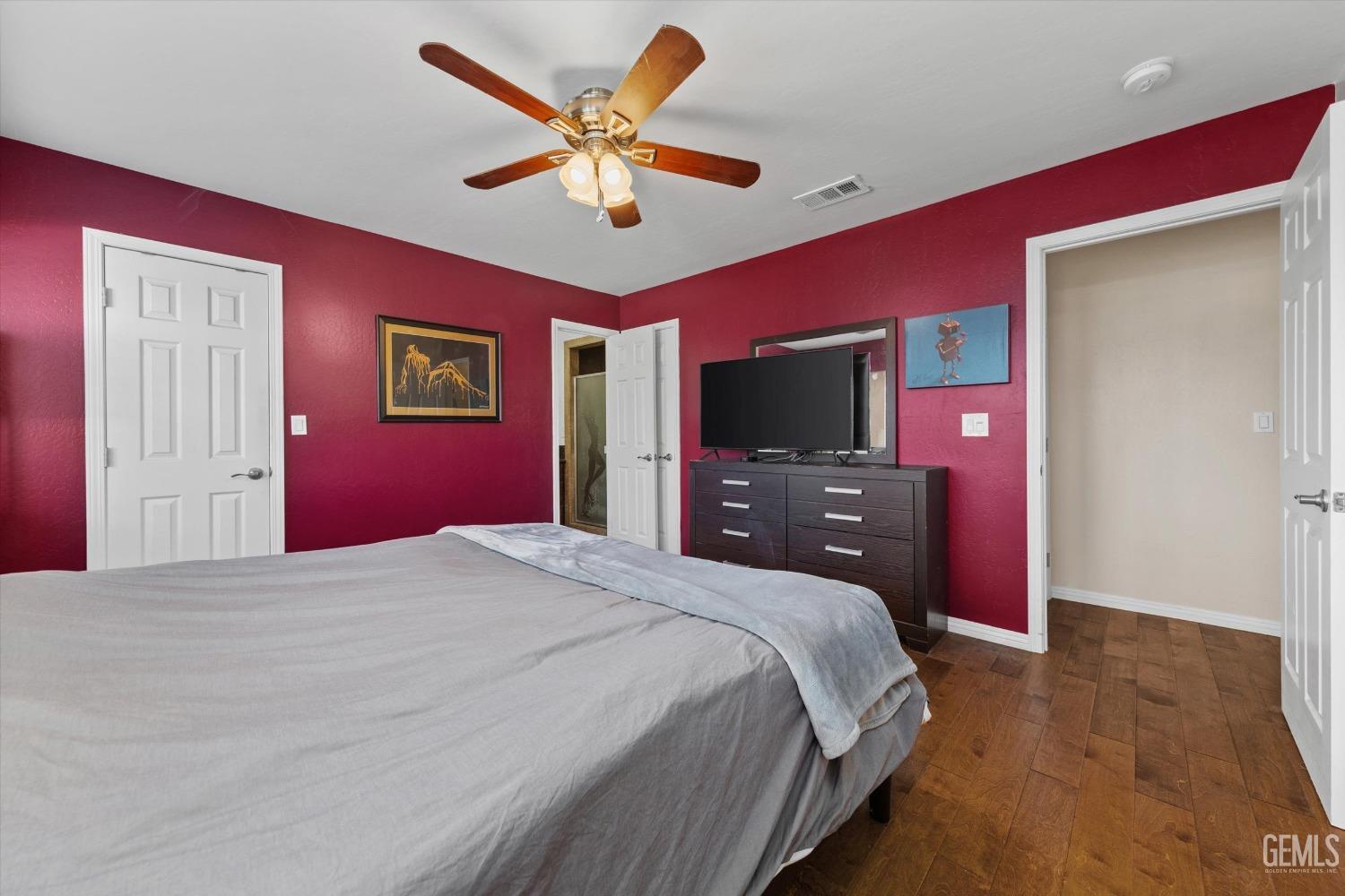 Undisclosed Address Bakersfield, CA 93309 - Photo 19 of 31 a bedroom with a bed and a flat screen tv