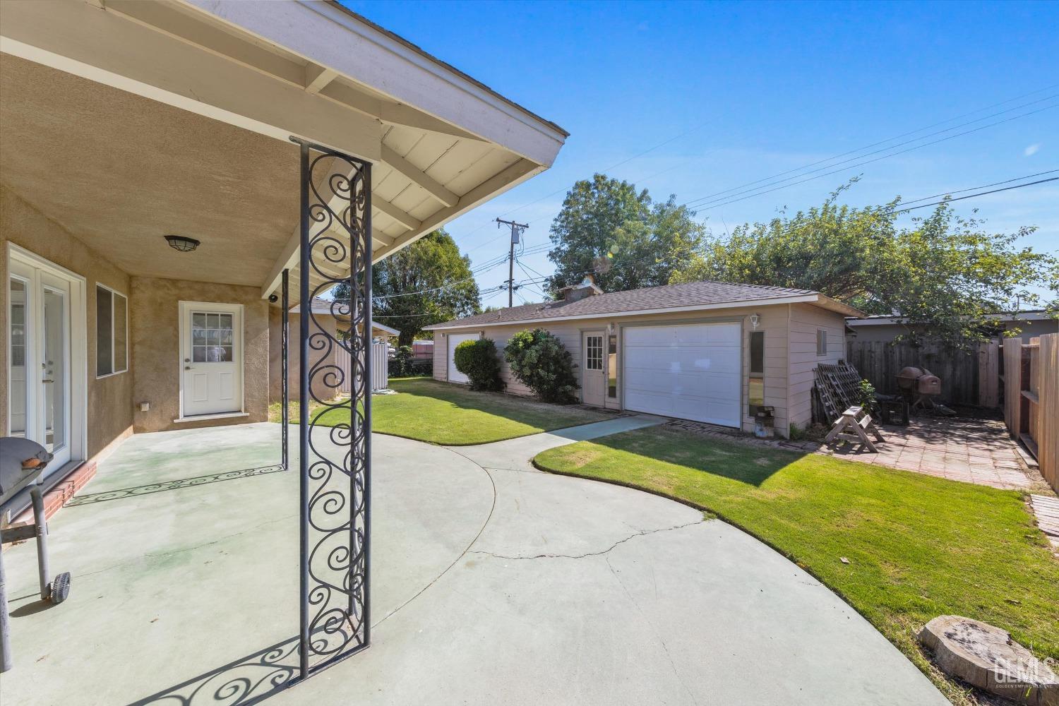 Undisclosed Address Bakersfield, CA 93309 - Photo 24 of 31 a view of a house with swimming pool and a yard