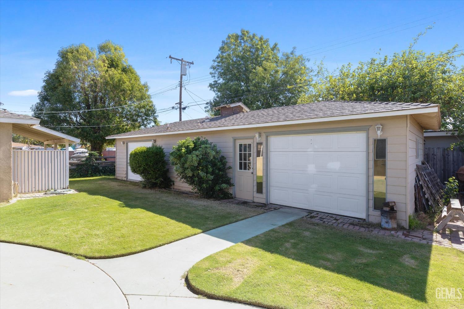 Undisclosed Address Bakersfield, CA 93309 - Photo 25 of 31 front view of a house with a yard