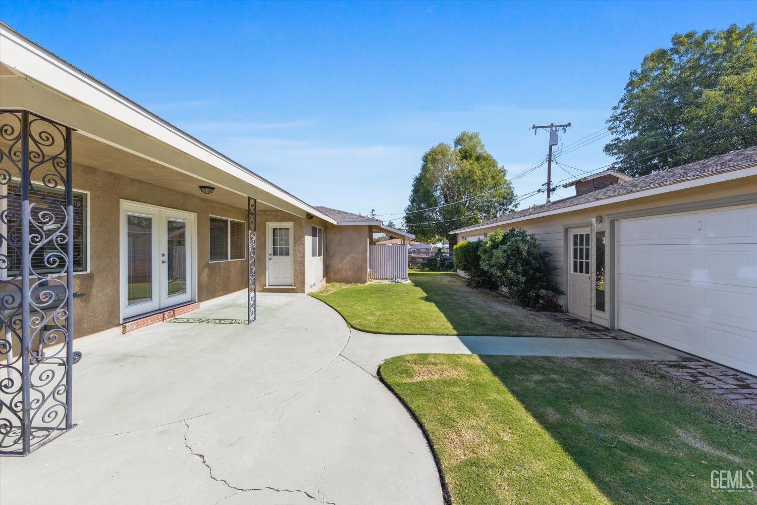 Undisclosed Address Bakersfield, CA 93309 - Photo 26 of 31 a view of a house with backyard and plants