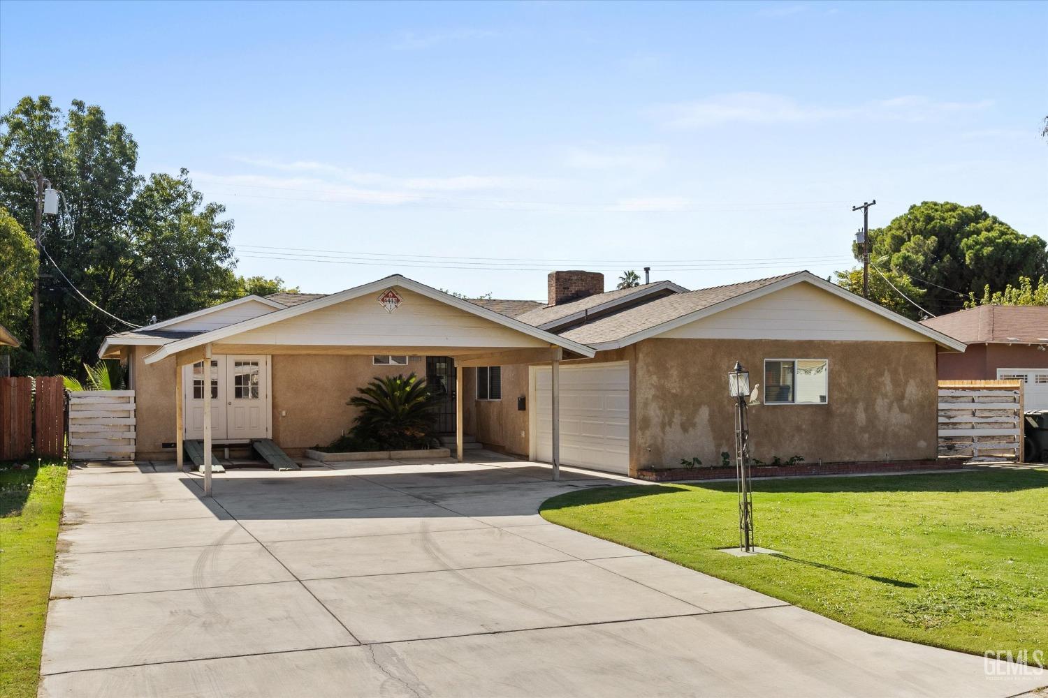 Undisclosed Address Bakersfield, CA 93309 - Photo 3 of 31 a front view of a house with yard