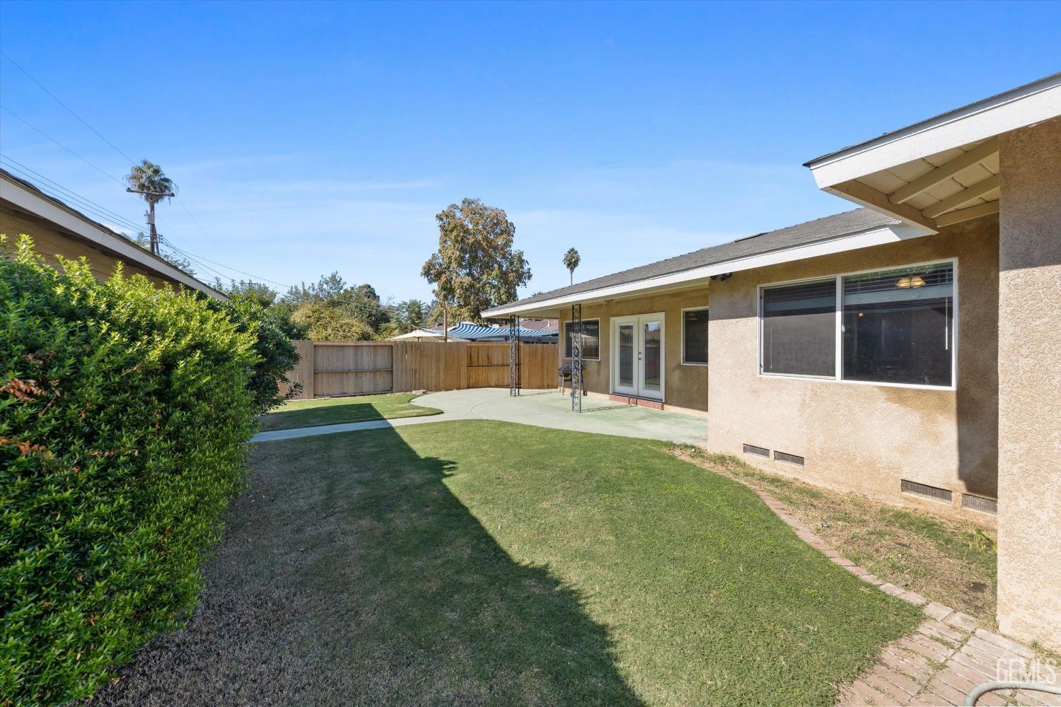 Undisclosed Address Bakersfield, CA 93309 - Photo 31 of 31 a front view of a house with a yard