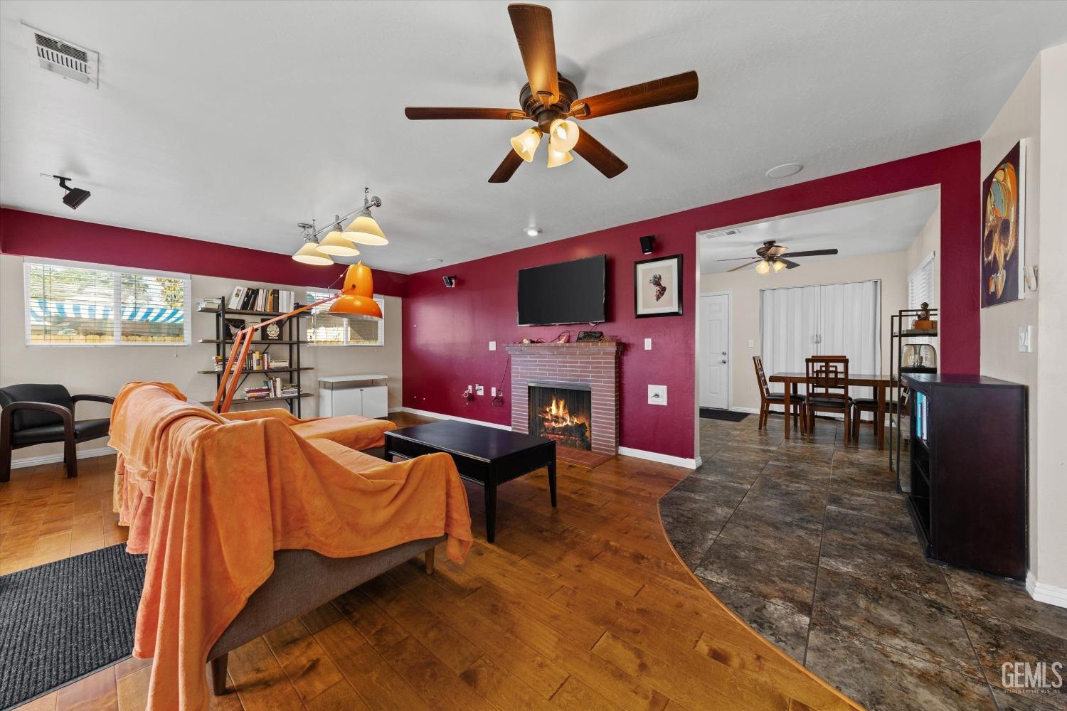 Undisclosed Address Bakersfield, CA 93309 - Photo 6 of 31 a bed room with furniture and a fireplace