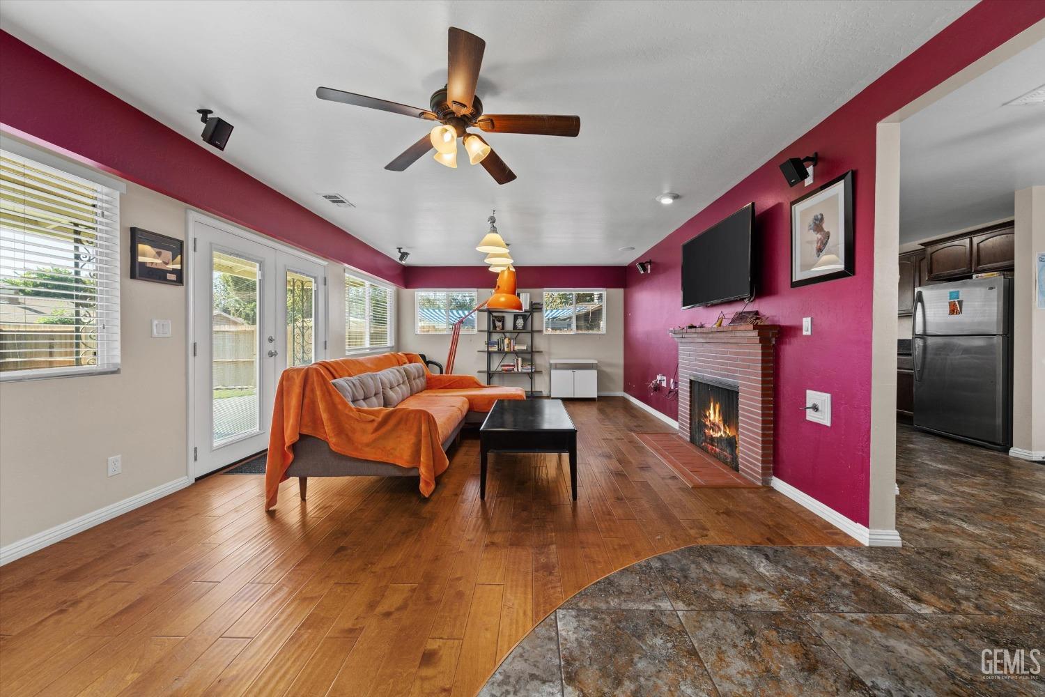 Undisclosed Address Bakersfield, CA 93309 - Photo 8 of 31 a living room with furniture a fireplace and a flat screen tv