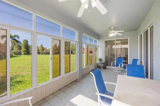 a aerial view of a house with yard and green space