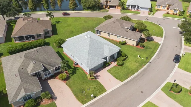 an aerial view of multiple houses with outdoor space