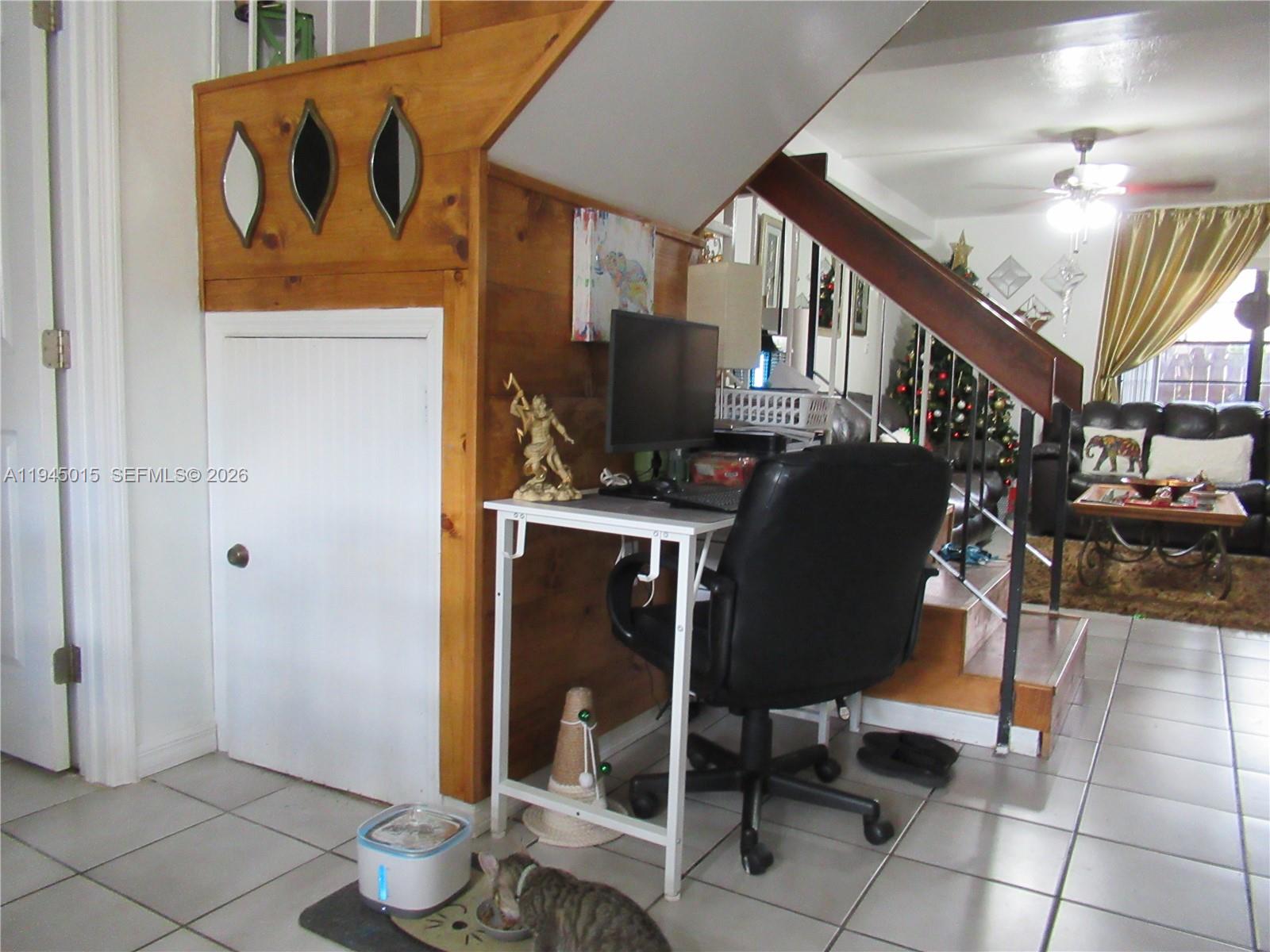 6601 Southwest 137th Court, Unit 2B Miami, FL 33183 - Photo 13 of 41 a workspace with furniture and rug