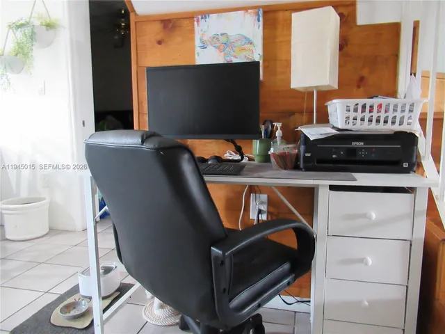 a view of living room with furniture and a fireplace