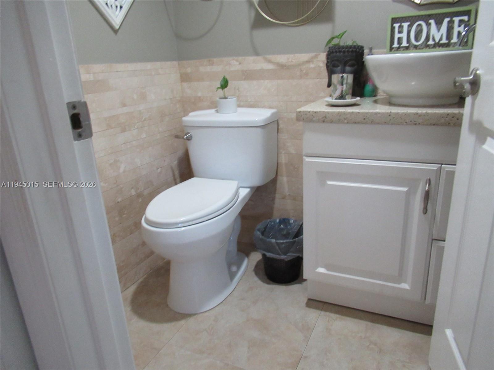 6601 Southwest 137th Court, Unit 2B Miami, FL 33183 - Photo 19 of 41 a bathroom with a toilet and a sink