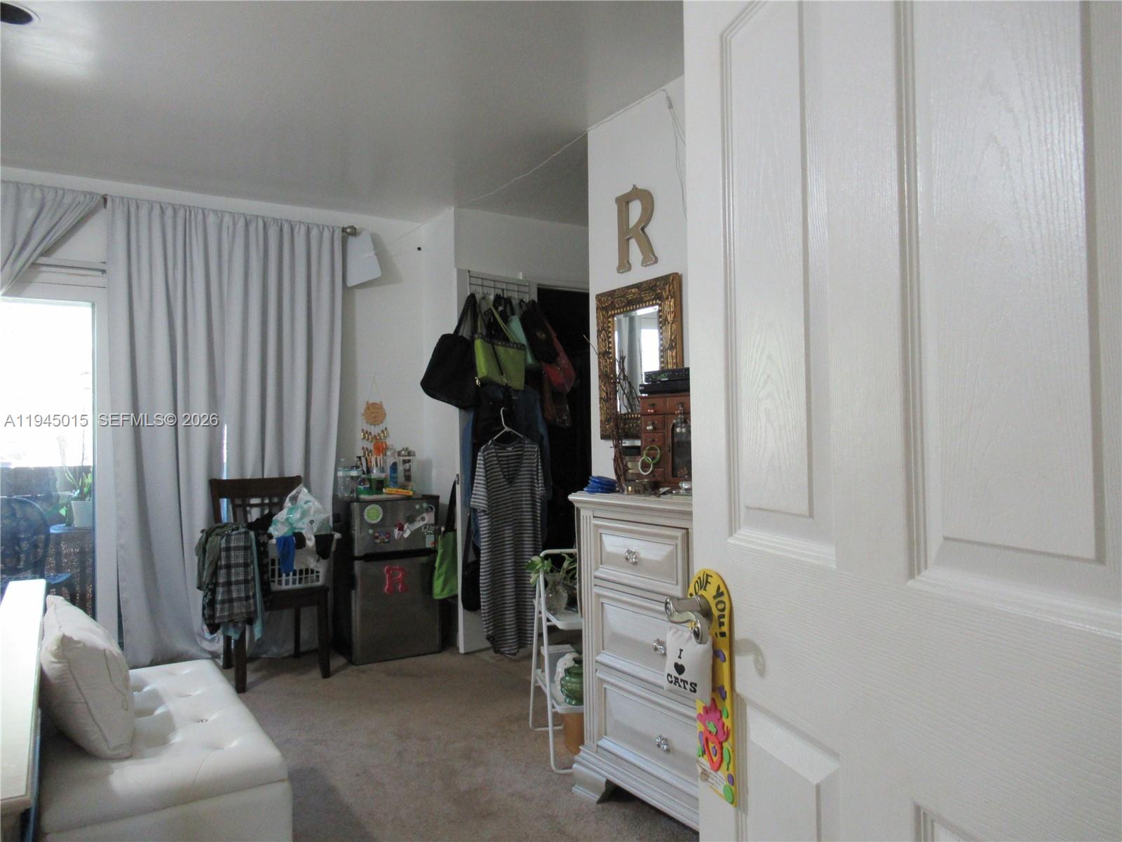 6601 Southwest 137th Court, Unit 2B Miami, FL 33183 - Photo 22 of 41 a view of walk in closet with clothes and shoes