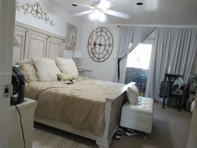 a view of walk in closet with clothes