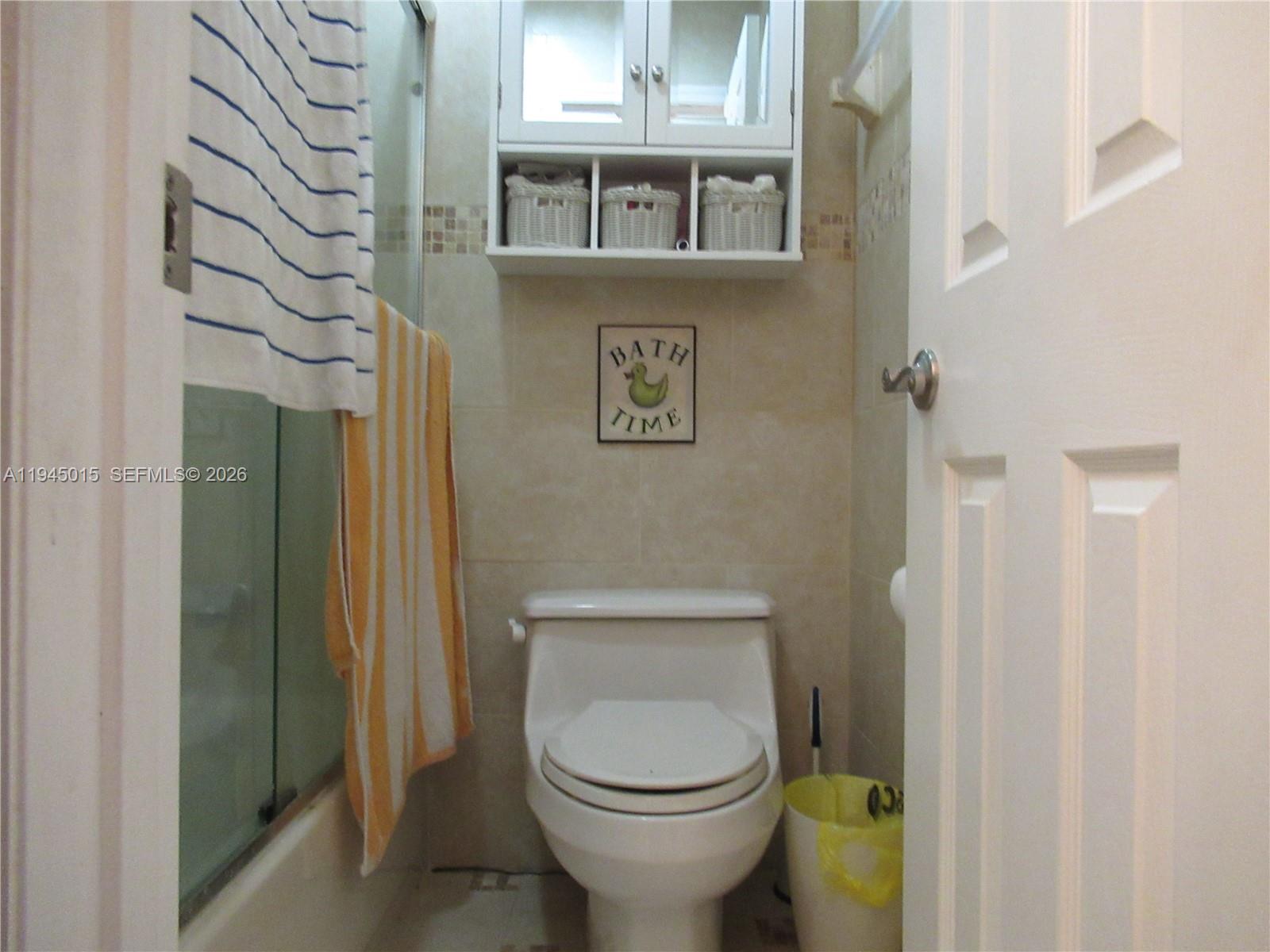 6601 Southwest 137th Court, Unit 2B Miami, FL 33183 - Photo 27 of 41 a bathroom with a toilet and a shower