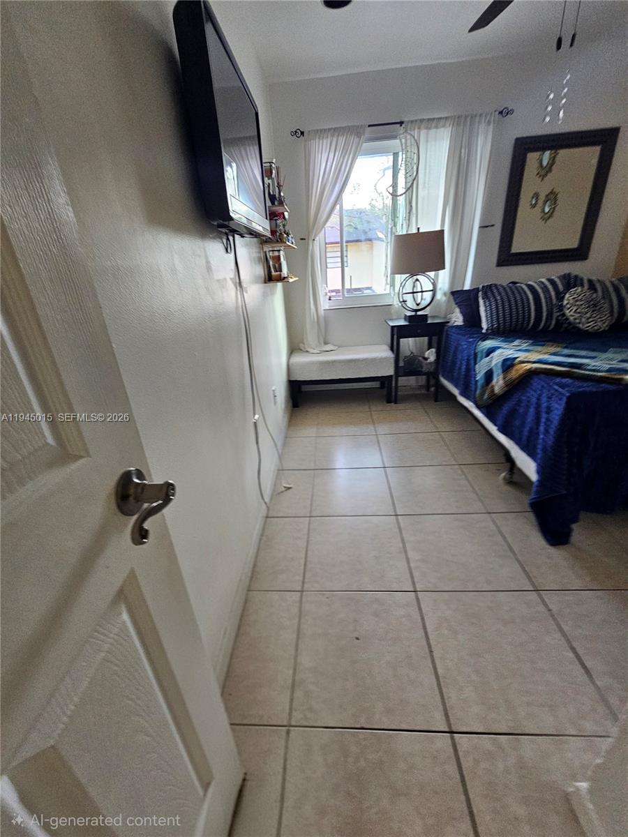 6601 Southwest 137th Court, Unit 2B Miami, FL 33183 - Photo 29 of 41 a living room with furniture and a window