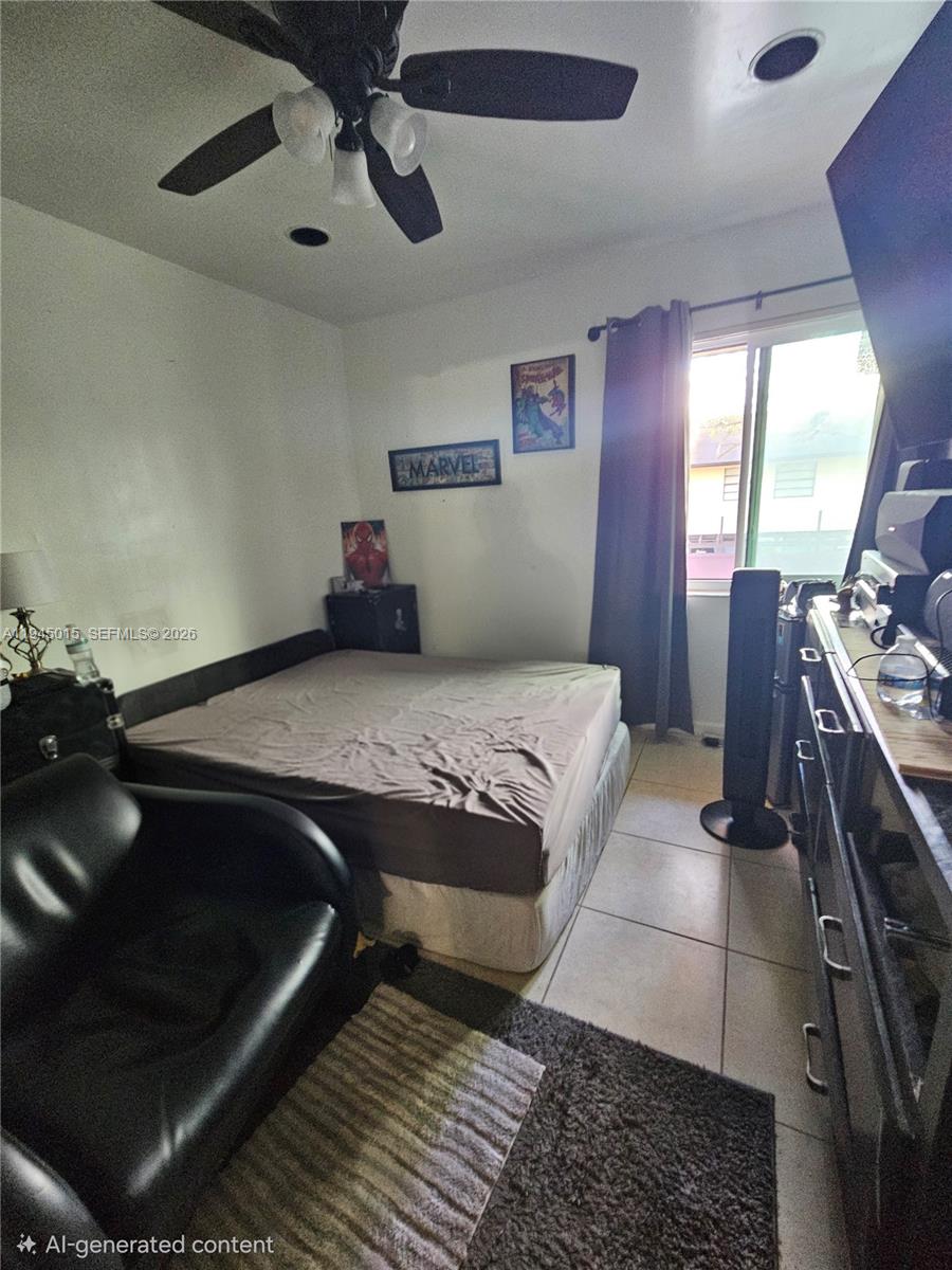 6601 Southwest 137th Court, Unit 2B Miami, FL 33183 - Photo 31 of 41 a bedroom with a bed and wooden floor