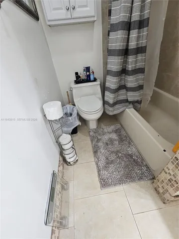 a view of balcony with wooden floor and a potted plant