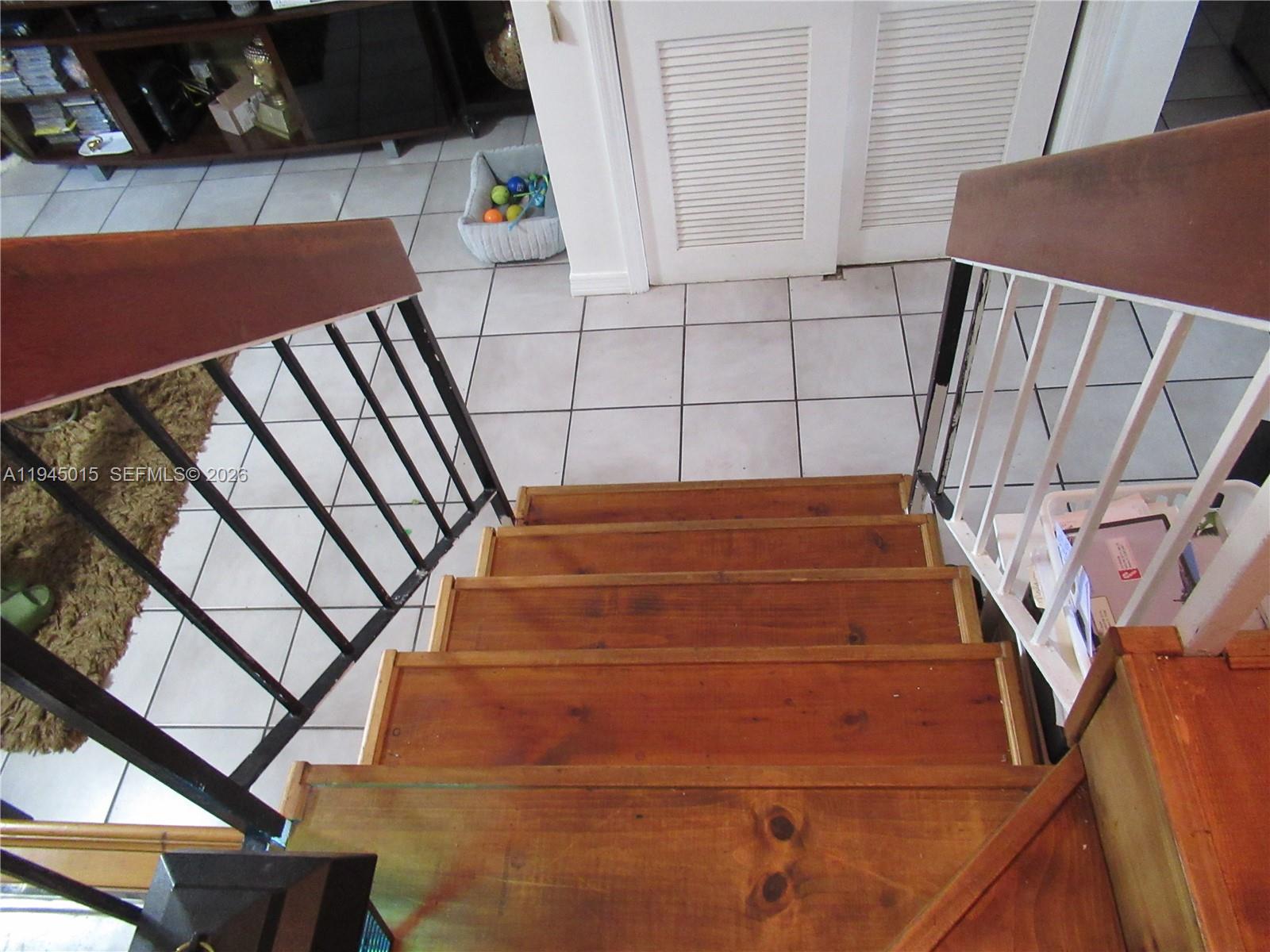 6601 Southwest 137th Court, Unit 2B Miami, FL 33183 - Photo 36 of 41 a view of an empty room with stairs