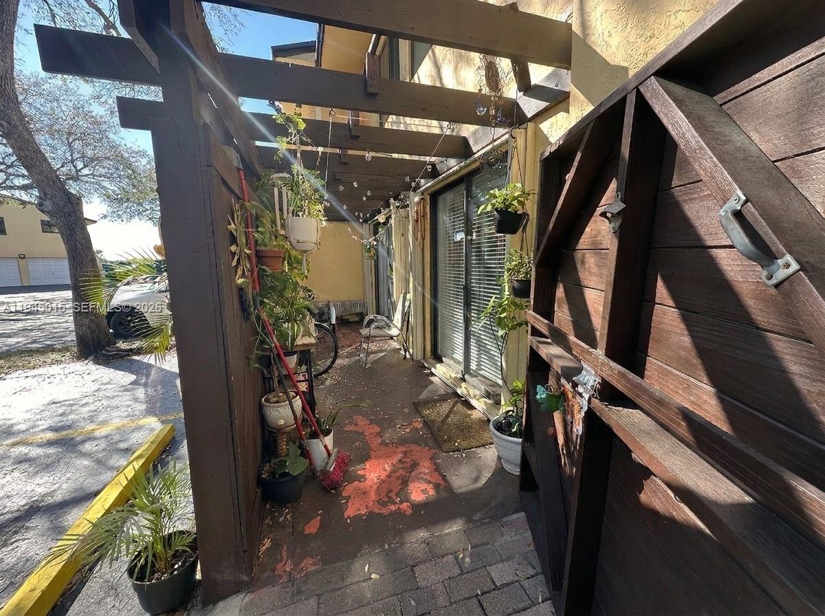 6601 Southwest 137th Court, Unit 2B Miami, FL 33183 - Photo 51 of 59 Back Patio