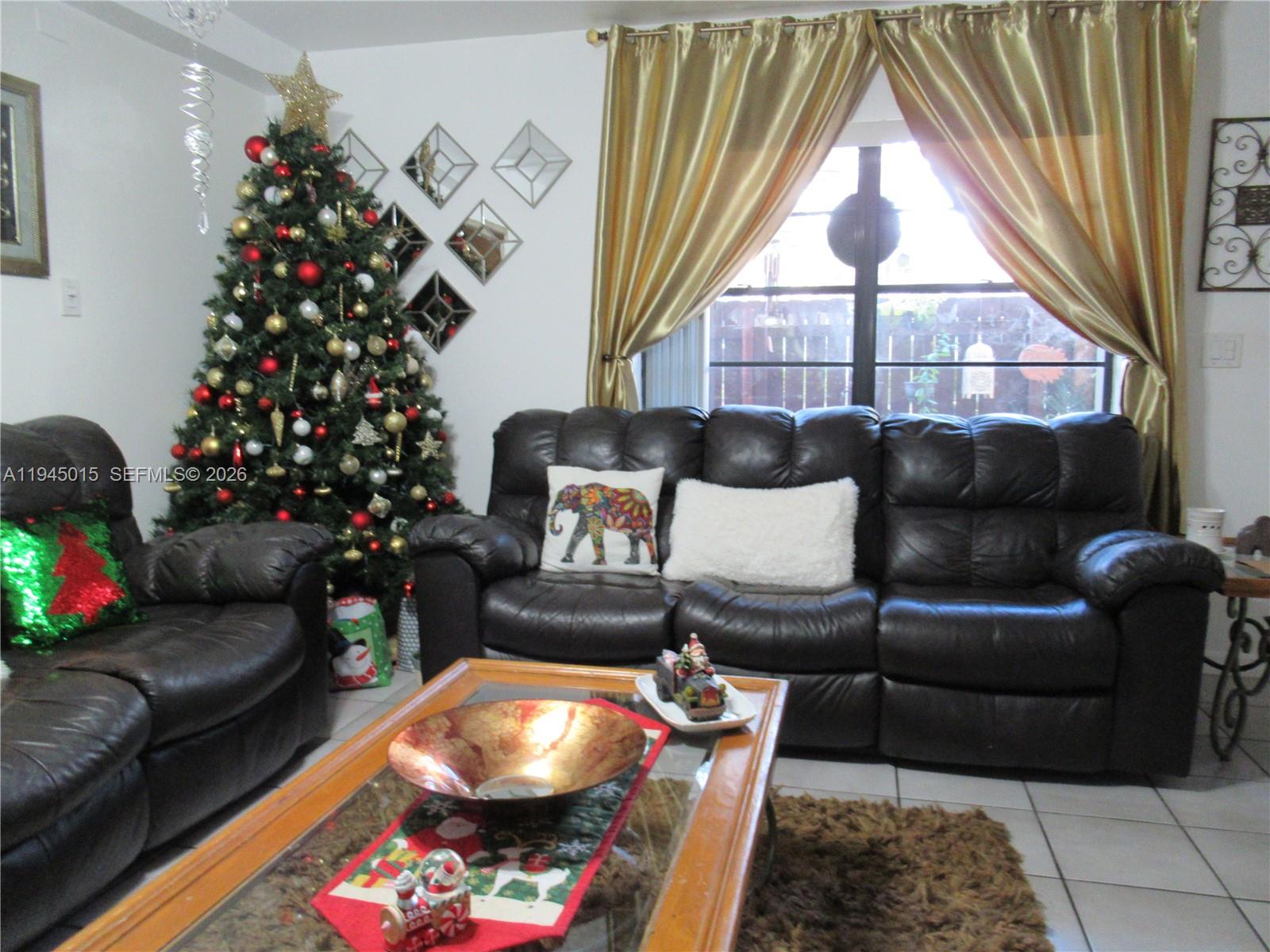 6601 Southwest 137th Court, Unit 2B Miami, FL 33183 - Photo 8 of 41 a living room with furniture and a large window