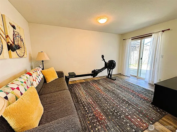 a view of a livingroom with furniture and a window