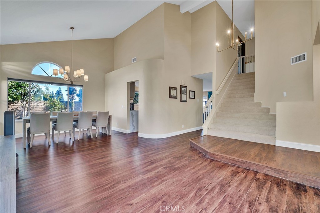 1780 North Azure Street Anaheim, CA 92807 - Photo 11 of 68 a view of a living room and dining room with wooden floor