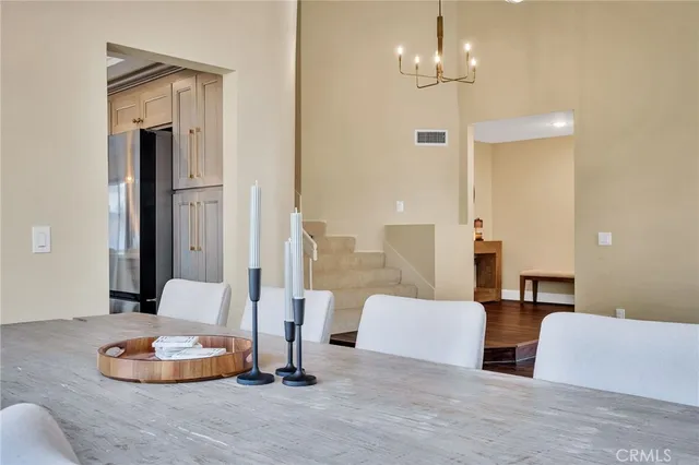 a kitchen with stainless steel appliances sink cabinets and wooden floor