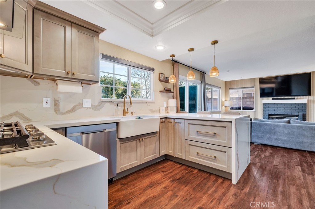 1780 North Azure Street Anaheim, CA 92807 - Photo 19 of 68 a kitchen with stainless steel appliances sink cabinets and wooden floor