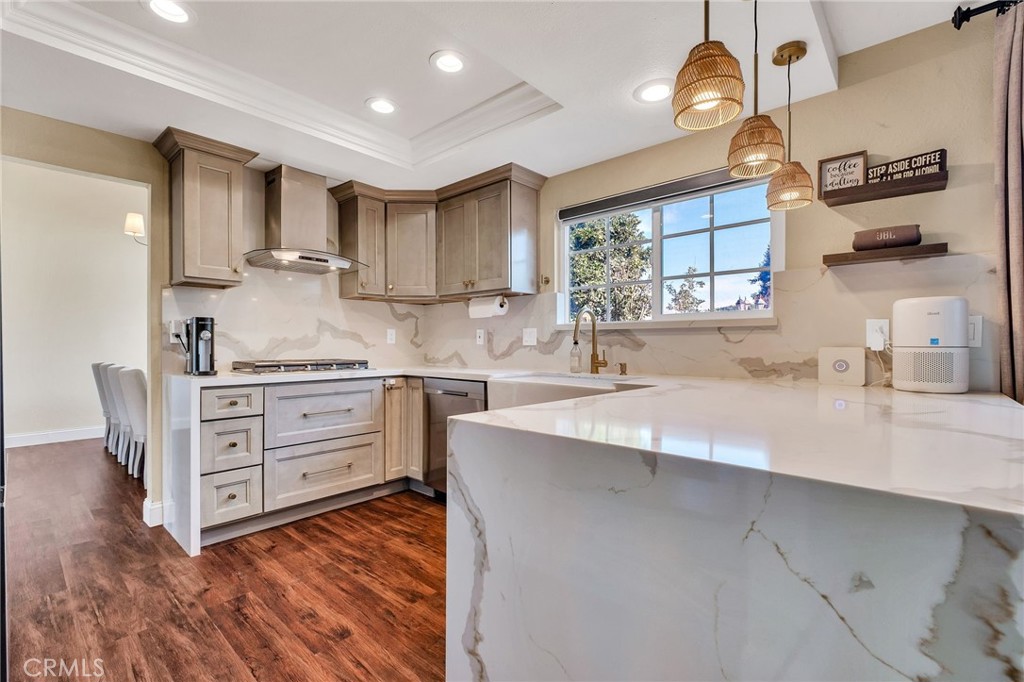 1780 North Azure Street Anaheim, CA 92807 - Photo 20 of 68 a kitchen with stainless steel appliances a sink stove and cabinets