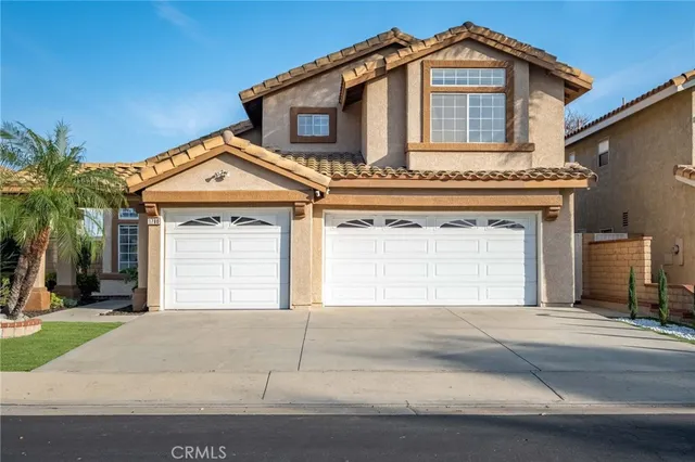 a front view of a house with a garage