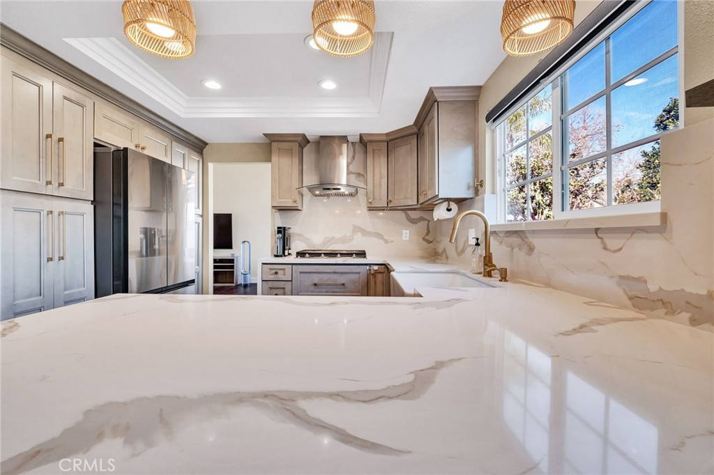 1780 North Azure Street Anaheim, CA 92807 - Photo 21 of 68 a kitchen with stainless steel appliances kitchen island granite countertop a refrigerator and a stove top oven