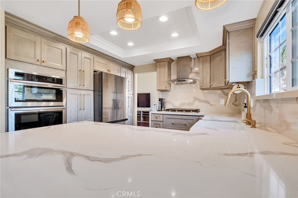 1780 North Azure Street Anaheim, CA 92807 - Photo 22 of 68 a kitchen with stainless steel appliances kitchen island granite countertop a stove and a sink