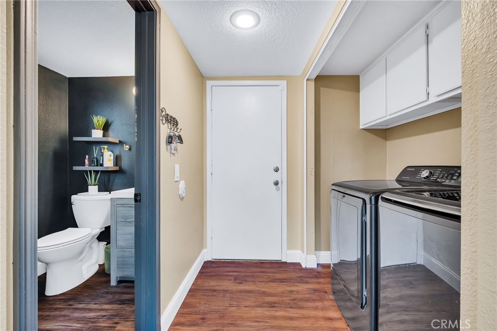 1780 North Azure Street Anaheim, CA 92807 - Photo 32 of 68 a bathroom with a toilet a sink and a mirror