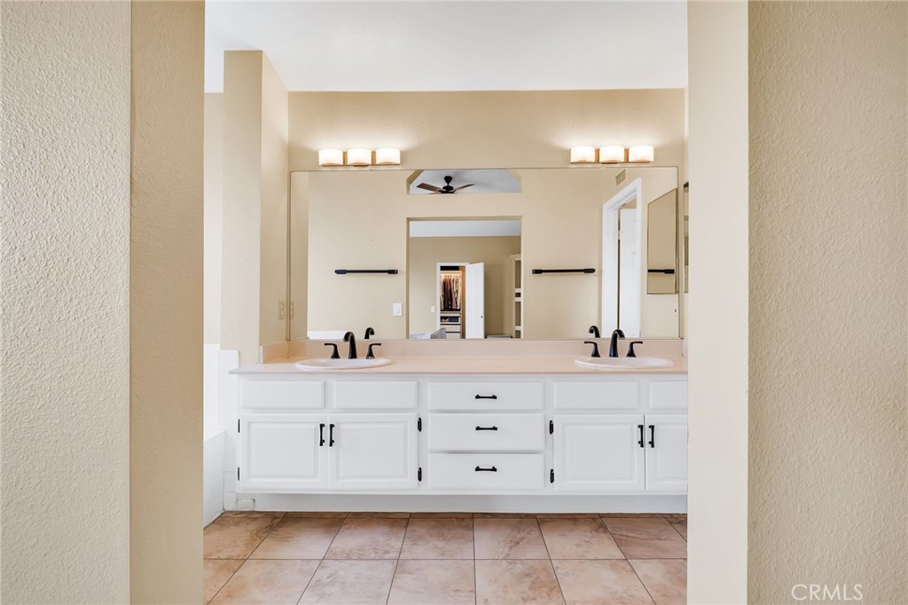 1780 North Azure Street Anaheim, CA 92807 - Photo 37 of 68 a bathroom with a sink vanity and mirror