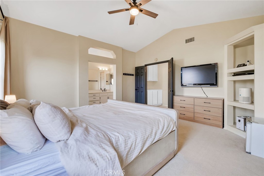 1780 North Azure Street Anaheim, CA 92807 - Photo 42 of 68 a spacious bedroom with a bed and a flat screen tv