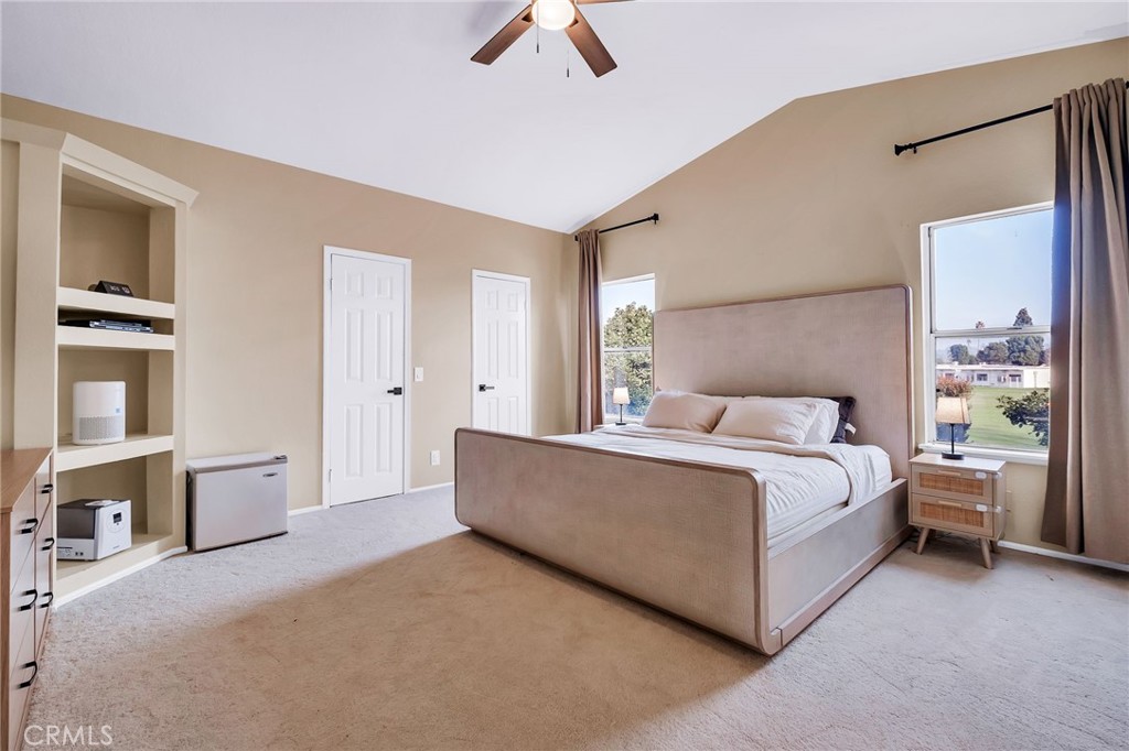 1780 North Azure Street Anaheim, CA 92807 - Photo 43 of 68 a spacious bedroom with a bed and a chandelier