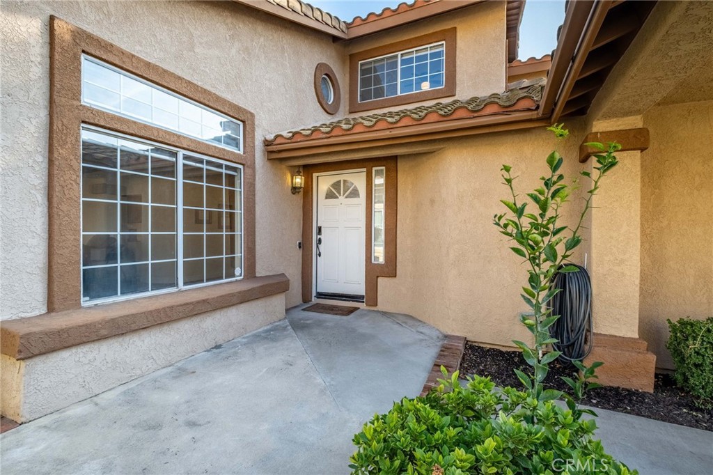 1780 North Azure Street Anaheim, CA 92807 - Photo 6 of 68 a view of a house with a potted plant and a window